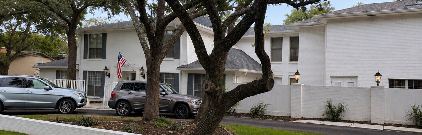 Dated home exterior with flat, worn paint before the project